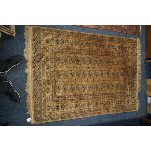 804 - Bokhara style rug. The central field decorated with three rows of twelve gul, 178cm x 130cm.