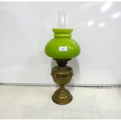 31 - Vintage brass oil lamp with green shade.