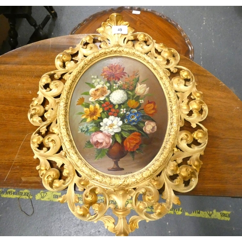 49 - Oval floral still life oil within ornate pierced gilt frame.L.26.5 x W.20cm