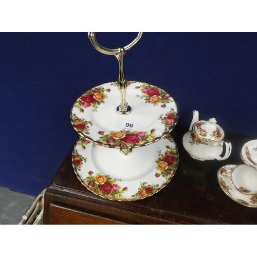 96 - Royal Albert Country Rose cake stand, sandwich plates and four miniature items.