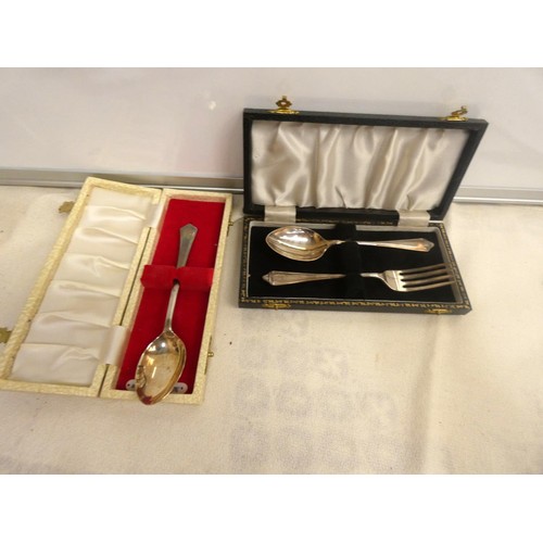 13 - Silver child's spoon and fork set and another silver spoon, both cased, weight 67g.