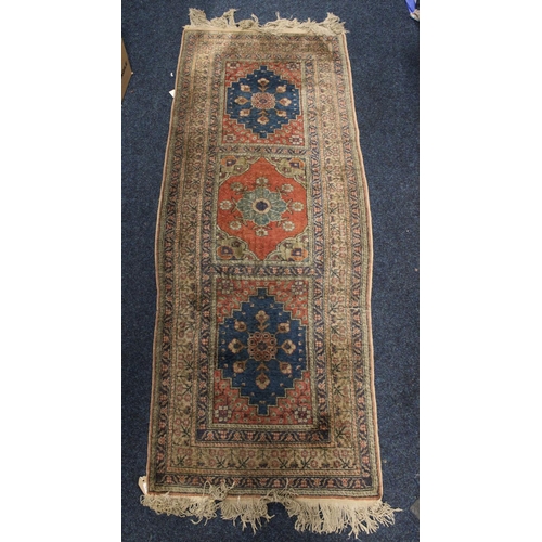 806 - Persian runner decorated with floral motifs on beige ground, 87cm x 72cm.