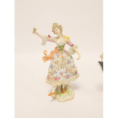 169 - Pair of Naples figures in 18th century dress, he waving and holding his hat, she holding a flower al... 