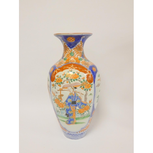 215 - Japanese Imari baluster vase decorated in typical palette with a lady in a garden, birds, etc., 37cm... 