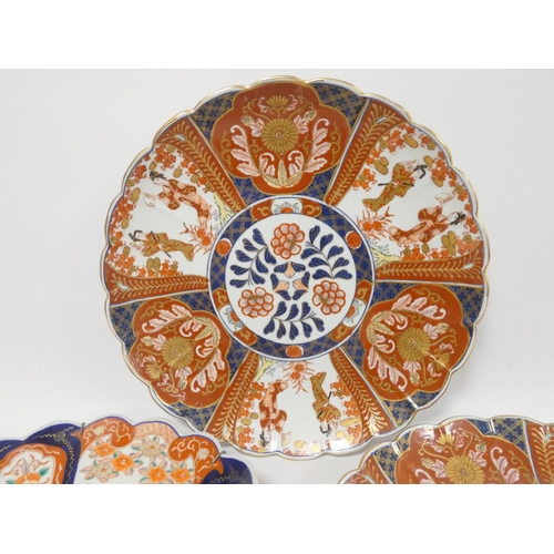 219 - 19th century Imari charger of lobed form decorated in panels in typical palette, 37cm diameter; also... 