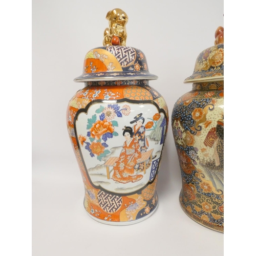 224 - Two modern Oriental baluster vases and covers, each heavily decorated with dog of fo finials, 64cm a... 