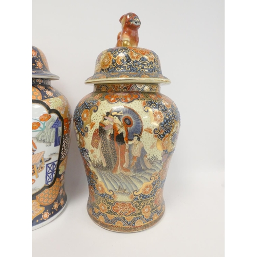 224 - Two modern Oriental baluster vases and covers, each heavily decorated with dog of fo finials, 64cm a... 