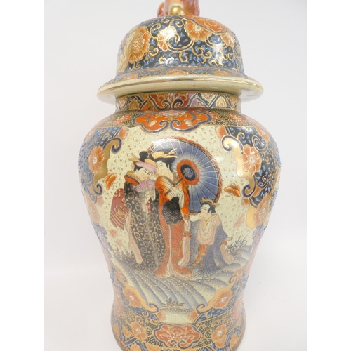 224 - Two modern Oriental baluster vases and covers, each heavily decorated with dog of fo finials, 64cm a... 