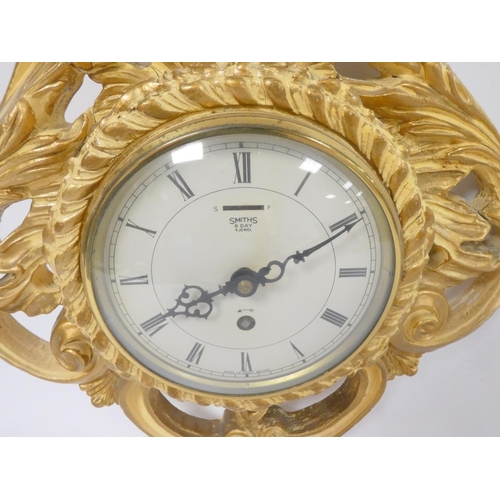 138 - Ansonia Smith's eight day wall clock in scrolling wood frame, 46cm high.