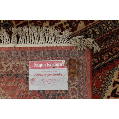 803 - Persian rust red and cream ground carpet, 360cm x 275cm.