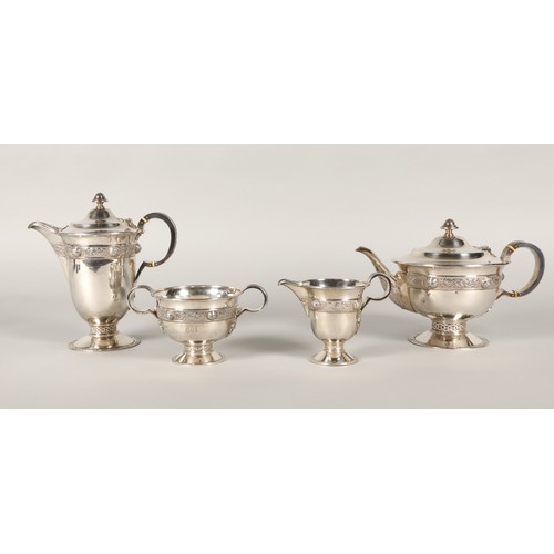 156 - Four piece silver tea service, consisting of teapot, coffee pot, sugar bowl and cream jug, decorated... 