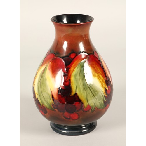 3 - Moorcroft pottery flambe vase in the leaf and berries pattern, impressed marks and signed to the bas... 