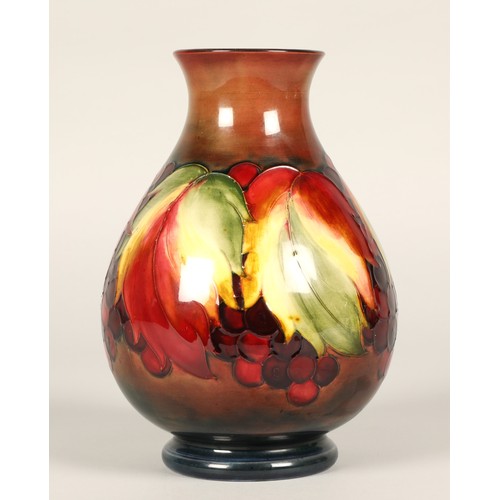 3 - Moorcroft pottery flambe vase in the leaf and berries pattern, impressed marks and signed to the bas... 