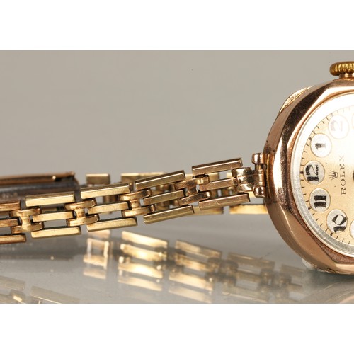 112 - Rolex ladies vintage 9ct gold wrist watch on a rolled gold and stainless steel strap.