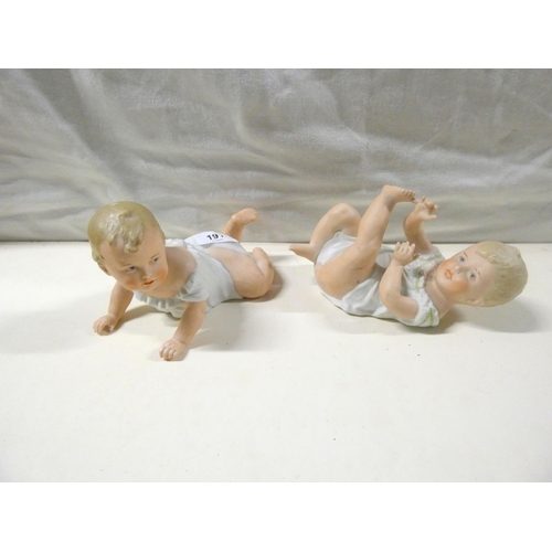 191 - Pair of continental porcelain piano babies.