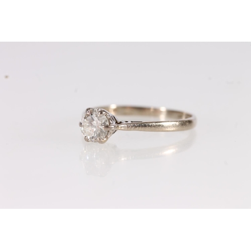 129 - 18ct white gold and diamond solitaire ring, the round brilliant cut diamond on a cathedral setting l... 