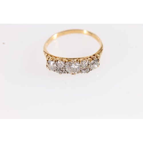 130 - Edwardian 18ct gold and seven diamond ring, the seven round cut graduating stones approximately 0.9 ... 