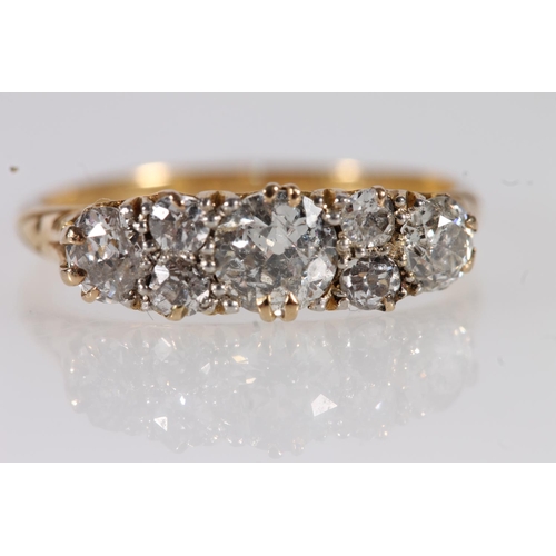 130 - Edwardian 18ct gold and seven diamond ring, the seven round cut graduating stones approximately 0.9 ... 