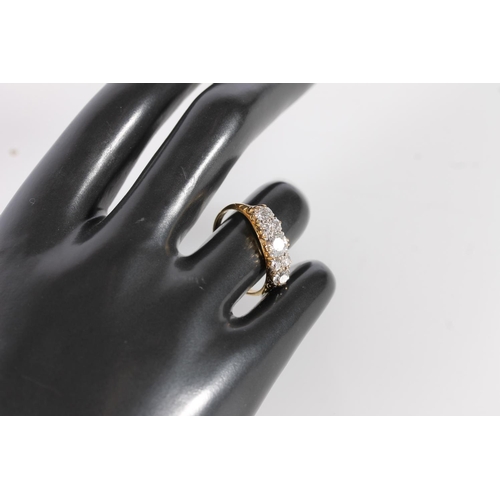 130 - Edwardian 18ct gold and seven diamond ring, the seven round cut graduating stones approximately 0.9 ... 