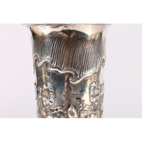 1 - Victorian silver vase, of tapering trumpet form, the body embossed with floral swags and ribbons, ra... 