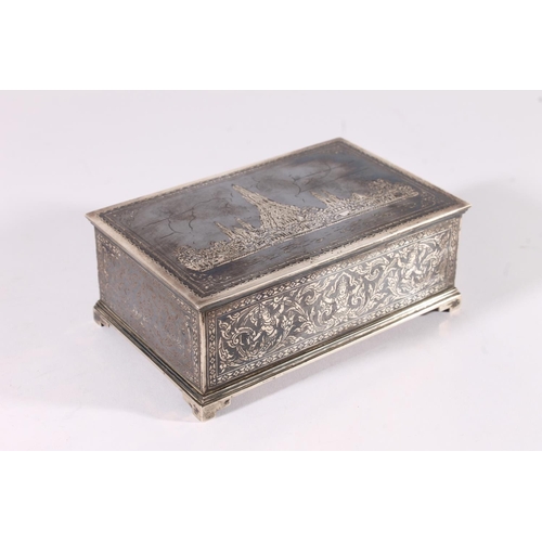 11 - Thai niello silver cigarette box, mid 20th century, the hinged lid decorated with a scene of Wat Pho... 