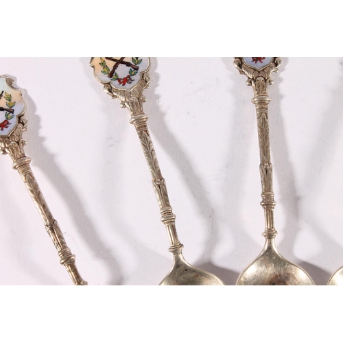 15 - Set of six George V silver teaspoons, the finials decorated in enamel with a rifle/small arms shooti... 