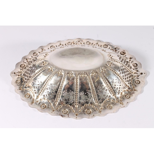 16 - Victorian silver basket form bowl, the oval bowl with wavy rim over a pierced and embossed interior,... 