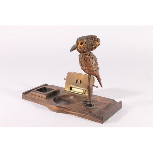 399 - Henry Howell YZ bird desk stand, c. 1930s, the rootwood and Bakelite bird on coromandel base with in... 