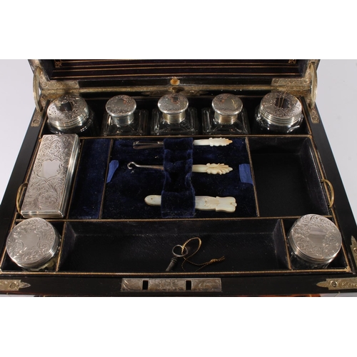 402 - Victorian coromandel and brass bound lady's travelling toilet box, fitted with an assortment of glas... 