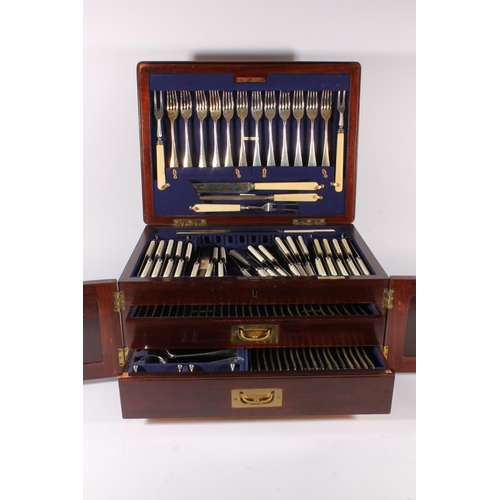 25 - George V oak cased canteen of silver plated cutlery for twelve, housed within Wellington type two-dr... 