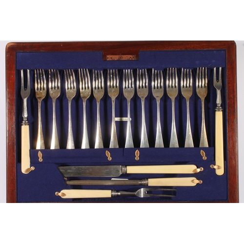 25 - George V oak cased canteen of silver plated cutlery for twelve, housed within Wellington type two-dr... 