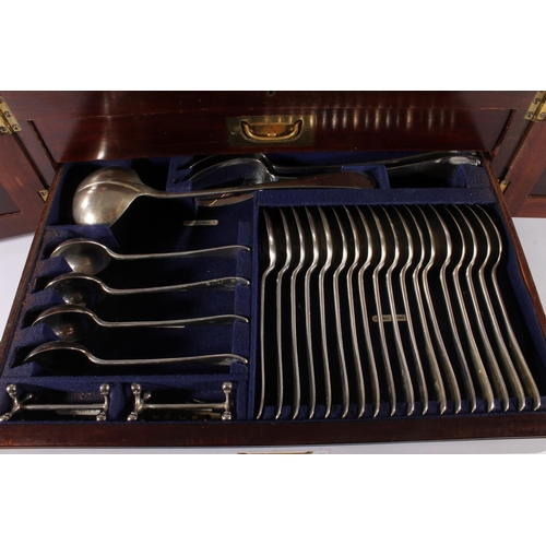 25 - George V oak cased canteen of silver plated cutlery for twelve, housed within Wellington type two-dr... 