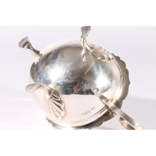 26 - George V silver sauce boat, with shaped rim, open scroll handle and shell shouldered pad feet, Harri... 