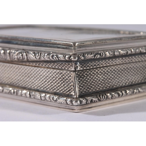 27 - William IV silver snuff box, of rectangular shape with engine turned decoration and floral cast thum... 