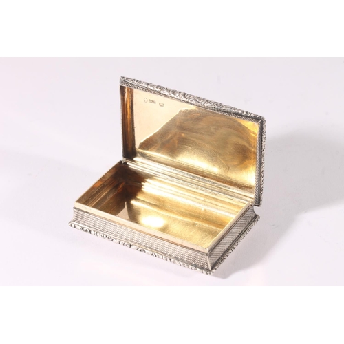 27 - William IV silver snuff box, of rectangular shape with engine turned decoration and floral cast thum... 