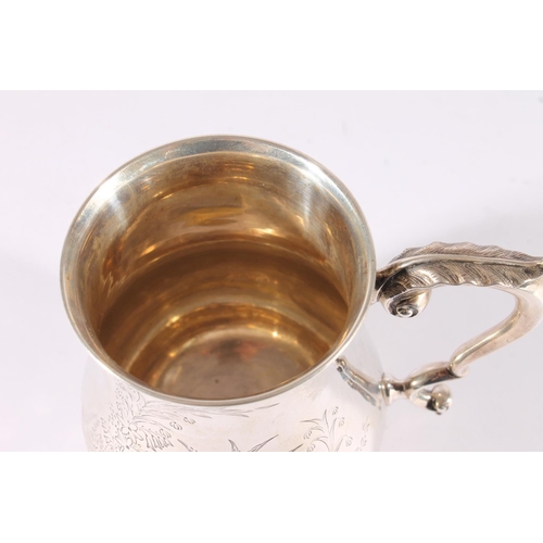 29 - Victorian silver tankard of baluster form, the S-scroll handle cast with an acanthus leaf thumb piec... 