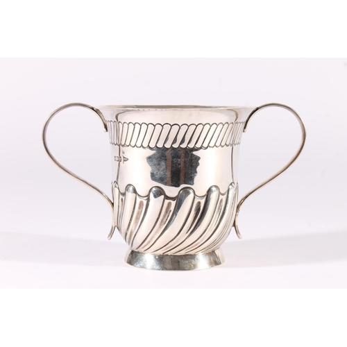 30 - Edwardian silver loving cup, the half lobed baluster body on a round pedestal foot with ear shape ha... 