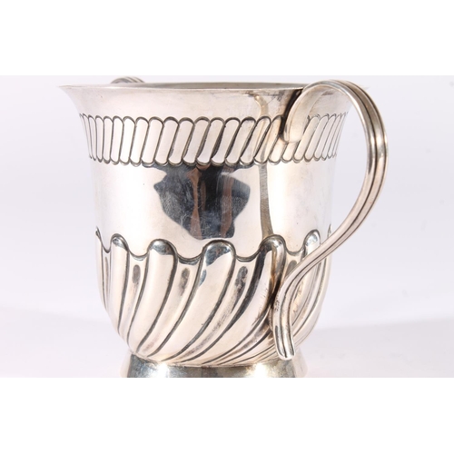 30 - Edwardian silver loving cup, the half lobed baluster body on a round pedestal foot with ear shape ha... 