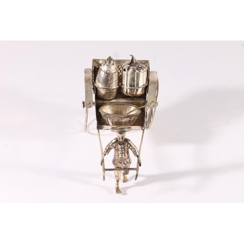 42 - Chinese white metal three-piece cruet set, modelled in the form of a man pulling a rickshaw, fitted ... 