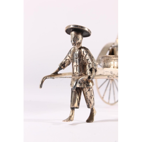 42 - Chinese white metal three-piece cruet set, modelled in the form of a man pulling a rickshaw, fitted ... 