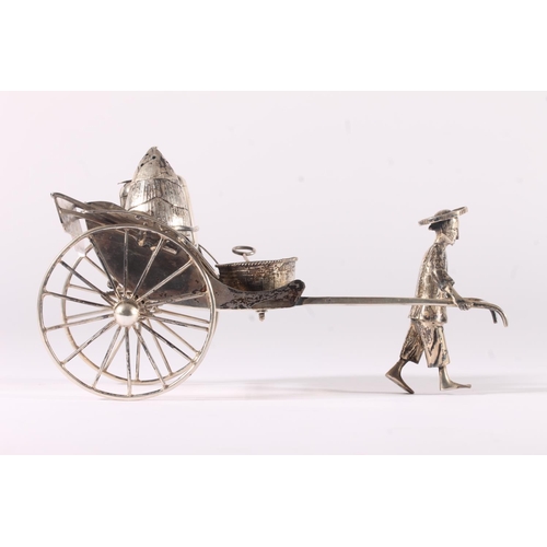 42 - Chinese white metal three-piece cruet set, modelled in the form of a man pulling a rickshaw, fitted ... 