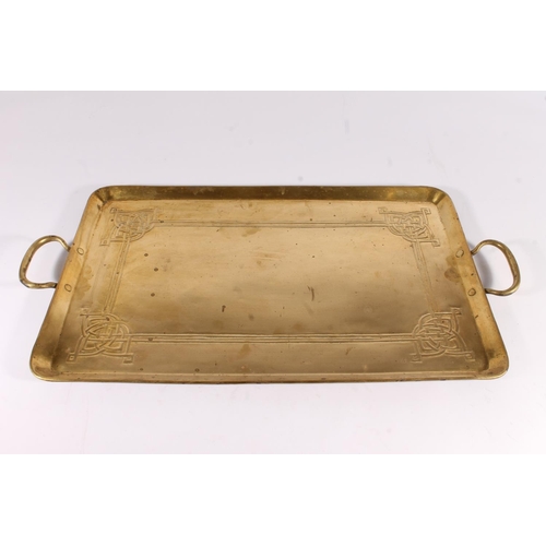 407 - Arts and Crafts style brass tray, the body with repousse knotwork design, 62cm wide.