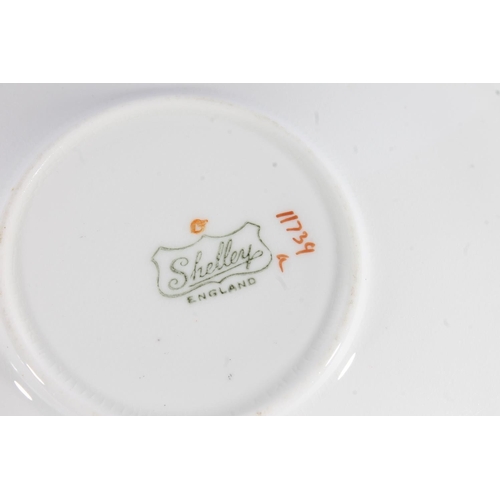 445 - Shelley Art Deco 'J' pattern trio, c1930s, the Eve shaped cup, side plate and saucer decorated with ... 