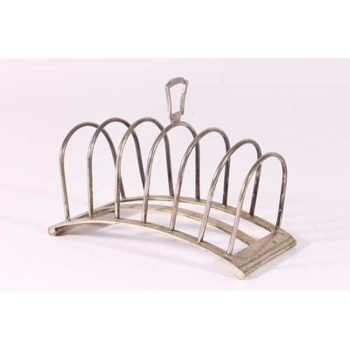 71 - Art Deco silver seven bar toast rack of arched shape, hallmarked for Brook & Son, Sheffield 1936... 