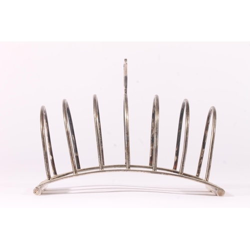 71 - Art Deco silver seven bar toast rack of arched shape, hallmarked for Brook & Son, Sheffield 1936... 