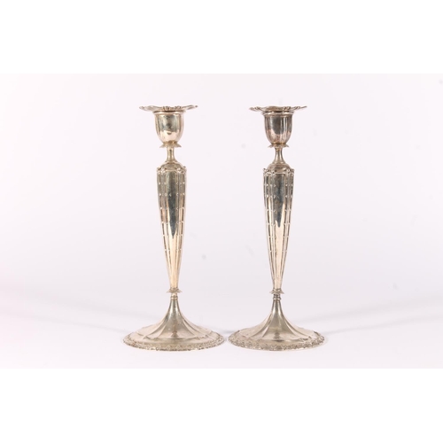 72 - Pair of American silver candlesticks by Tiffany & Co., stamped to the underside '14333 3960' and... 