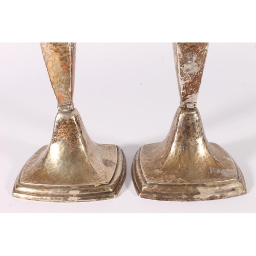 73 - Pair of American-style silver candlesticks with planished hand hammered decoration, stamped 'Sterlin... 