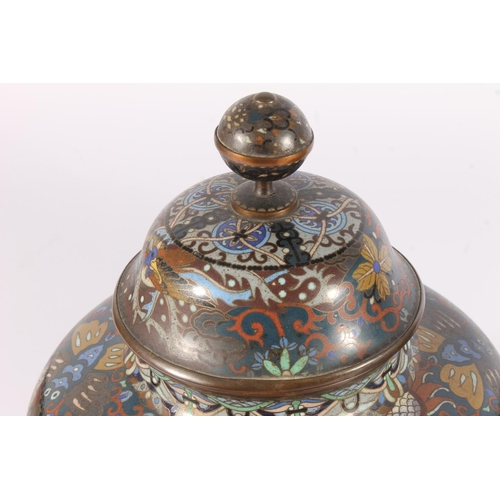 521 - Pair of Japanese cloisonne urns, Meiji period, of globular form with banded globe finial on a dome c... 