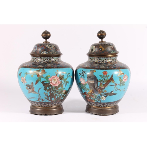 521 - Pair of Japanese cloisonne urns, Meiji period, of globular form with banded globe finial on a dome c... 