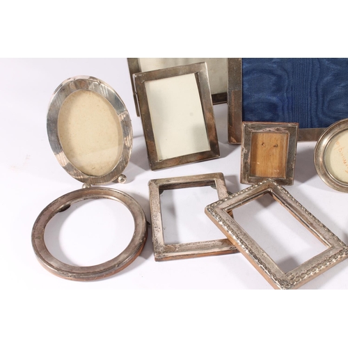 81 - Group of twelve silver photograph frames, the largest 22.5cm x 17.5cm. (12)